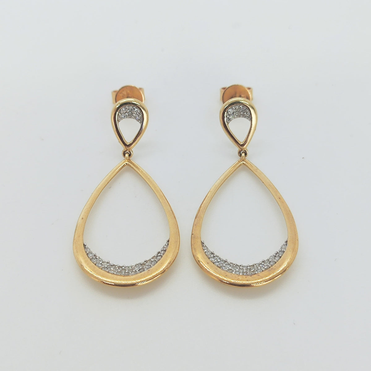 Aros doble gota en oro amarillo y brillantes