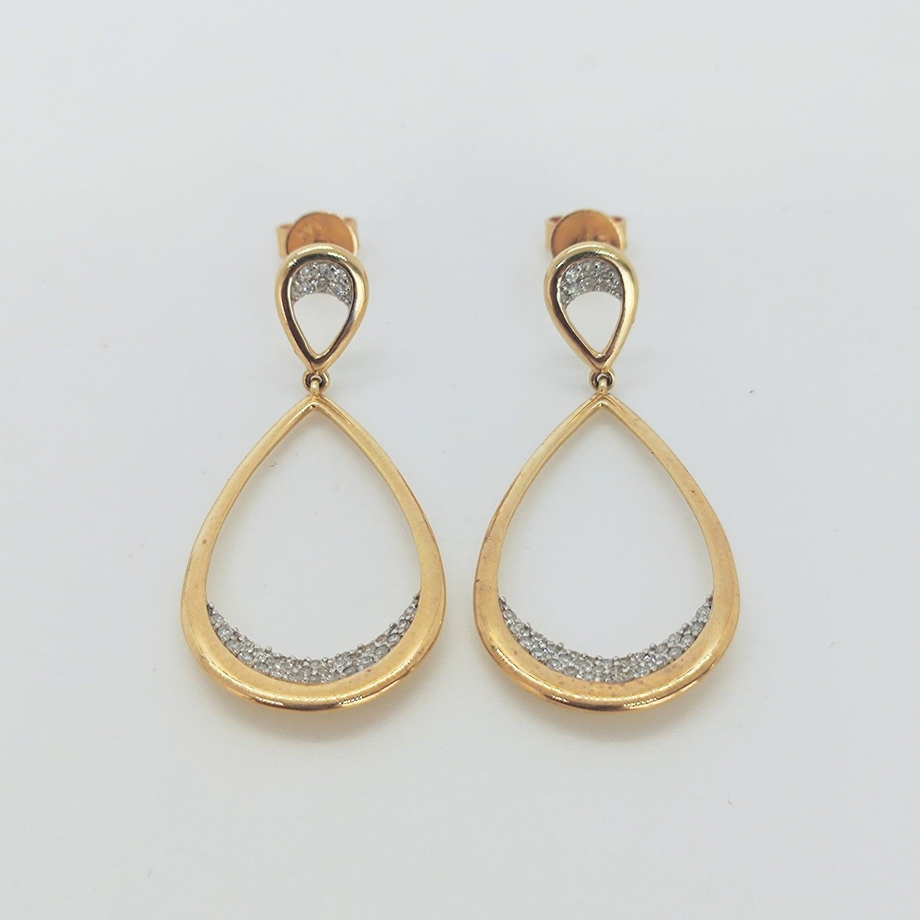 Aros doble gota en oro amarillo y brillantes