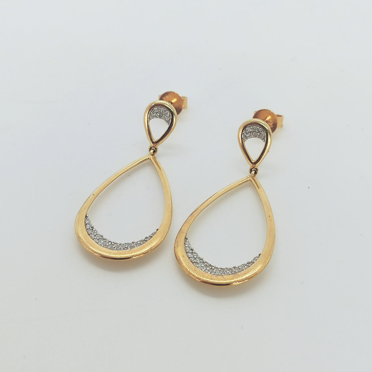 Aros doble gota en oro amarillo y brillantes